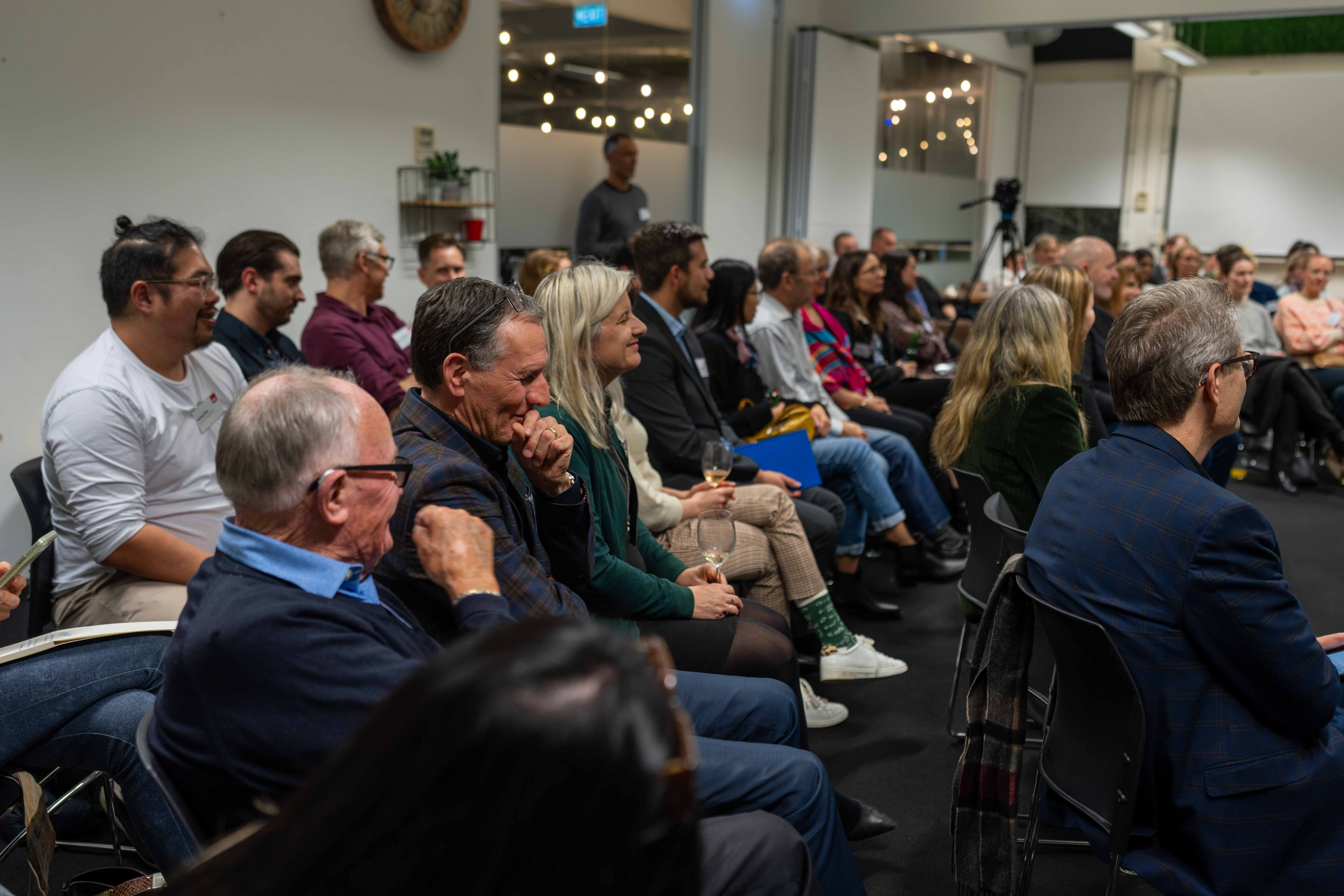 July Meetup - Attendees Listening to Presentation