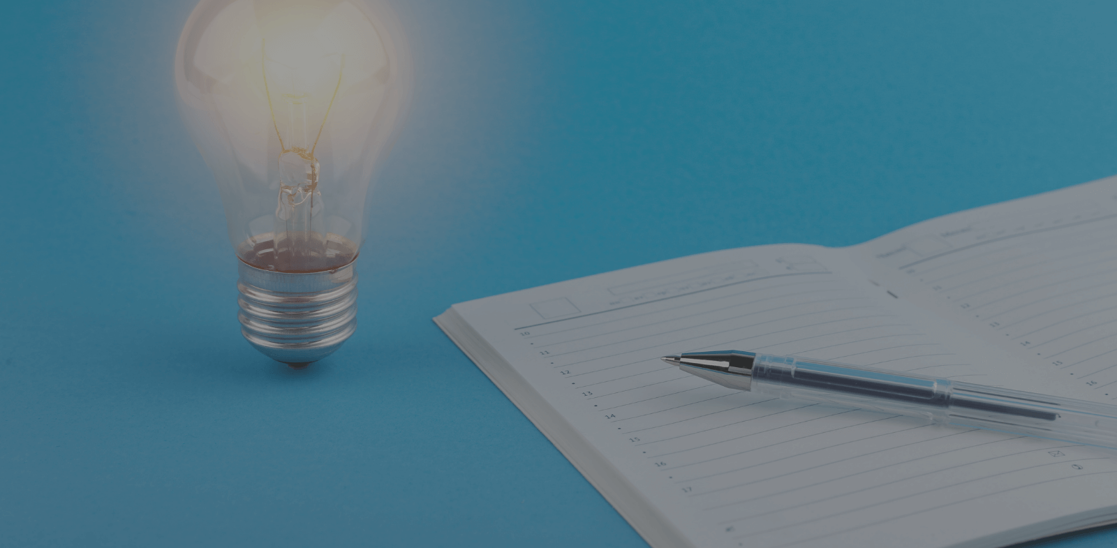 Light bulb and notebook