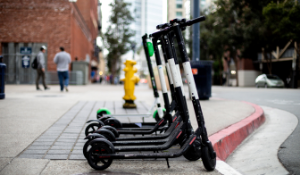 Row of e-scooters for rent on a street