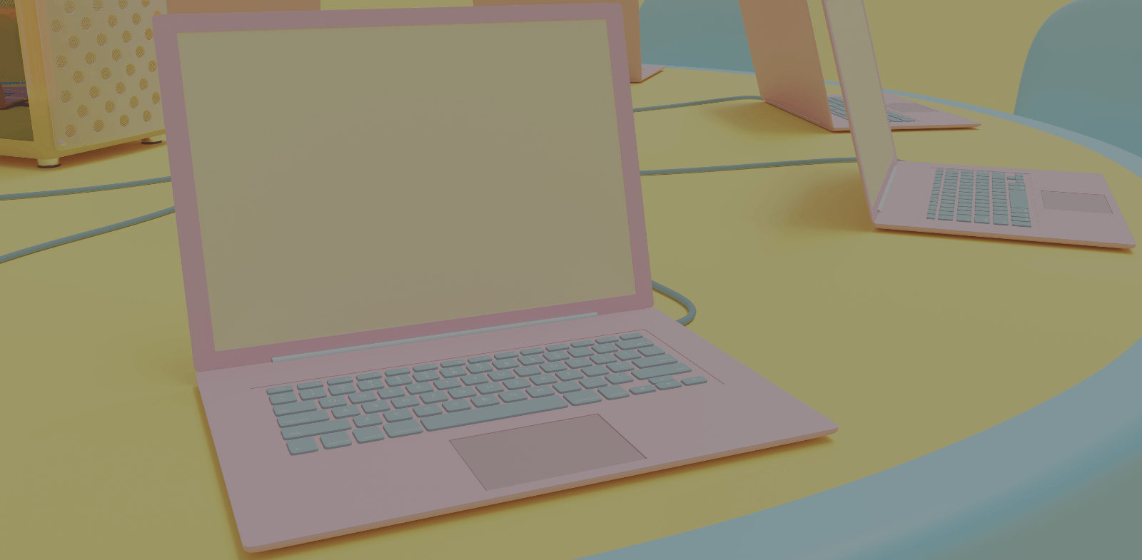pink laptop on yellow desk
