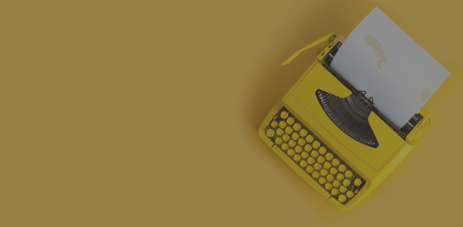yellow typewriter on yellow background