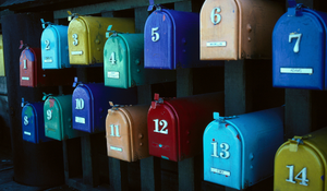 two rows of colourful mailboxes