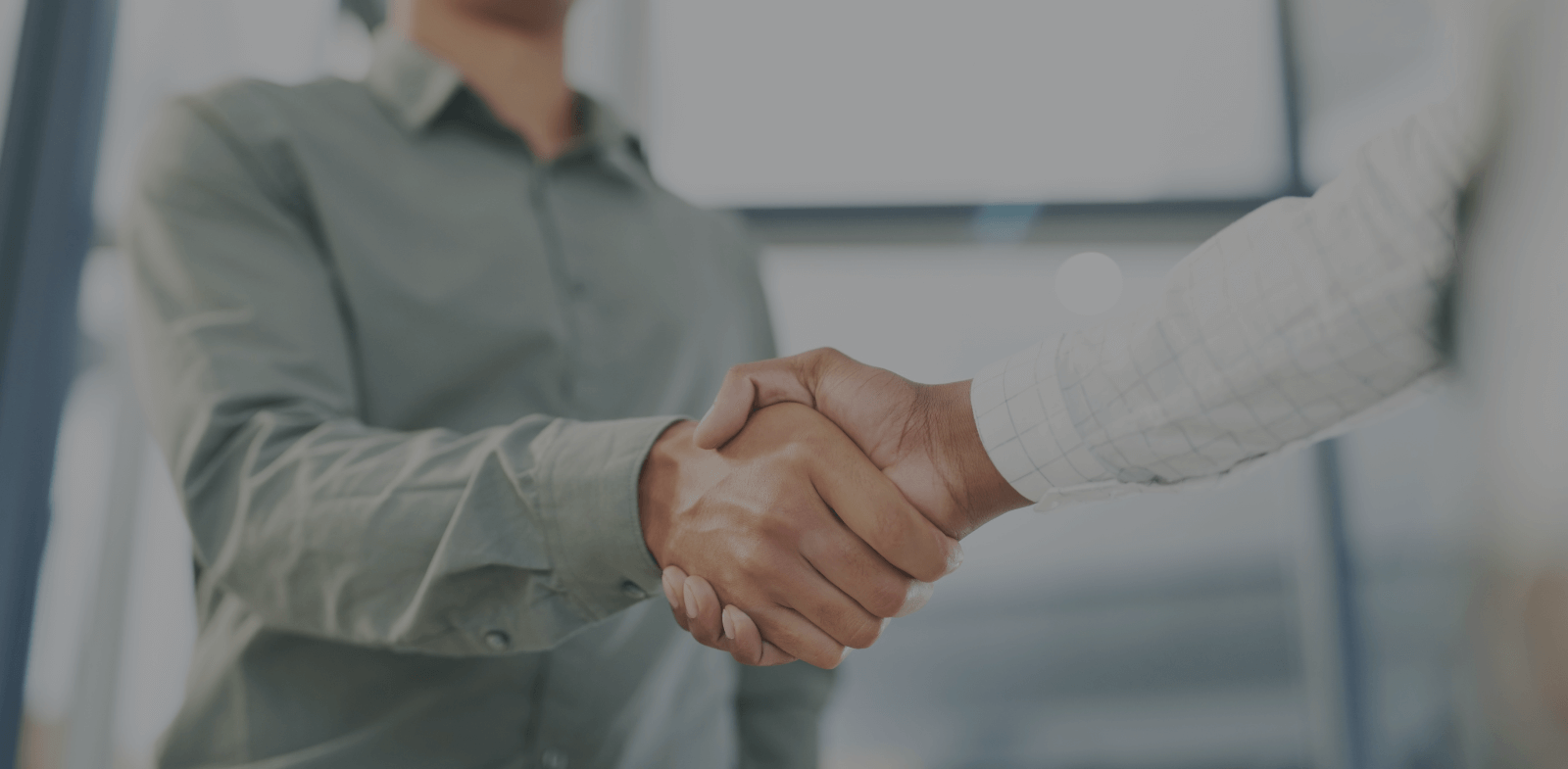 shot of two business people shaking hands