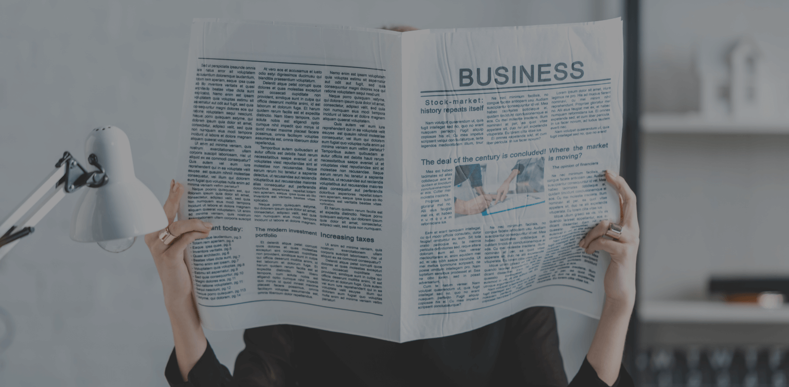 business woman reading newspaper