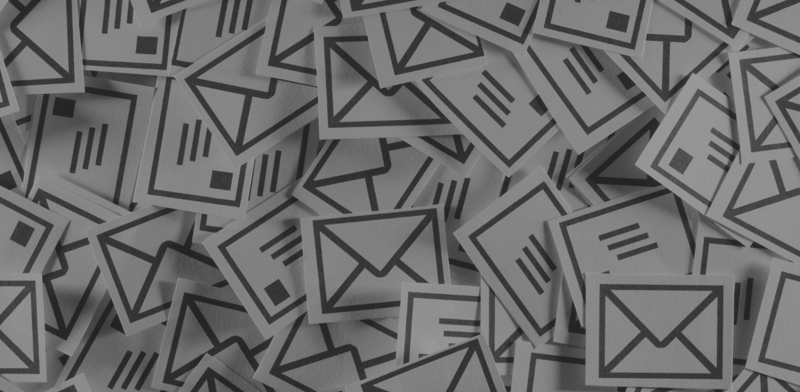 paper cut outs of email and envelope icons. concept of spam